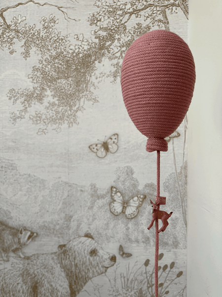 Blush hot air balloon decoration with animal design, perfect for baby nursery or gender reveal decor